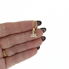 Brianne and Co 14k gold Naupaka Necklace in a hand