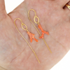 Brianne and Company Gold Fill Pink Coral Branch Threader Earrings on the palm of a hand