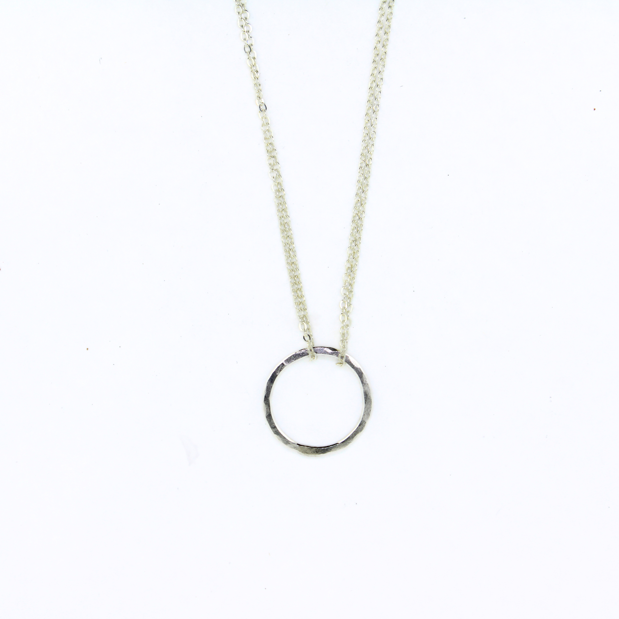 Brianne & Co necklace with string silver hammered circle