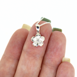 brianne & co close up of sterling silver plumeria with cz