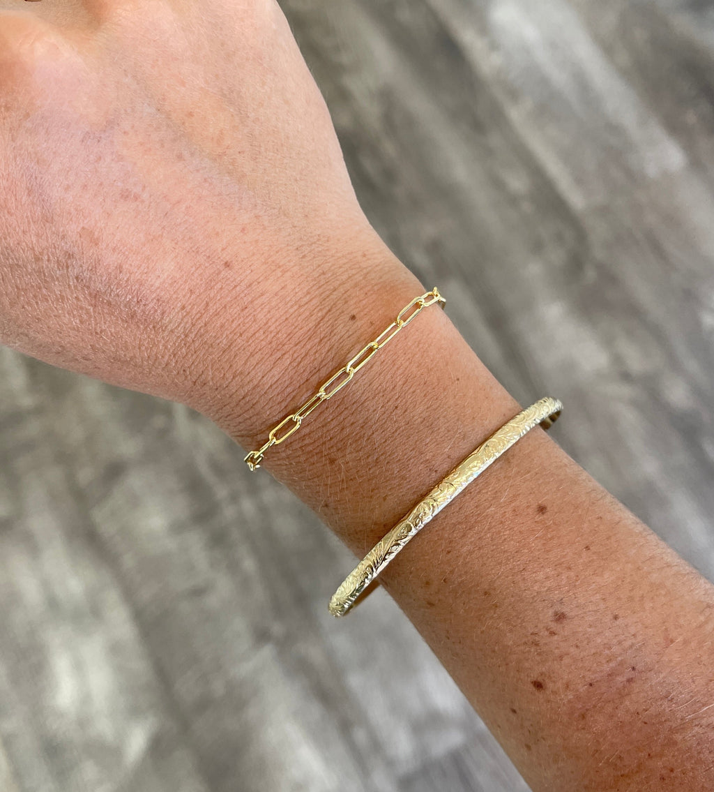 gold filled paper clip chain bracelet shown on wrist