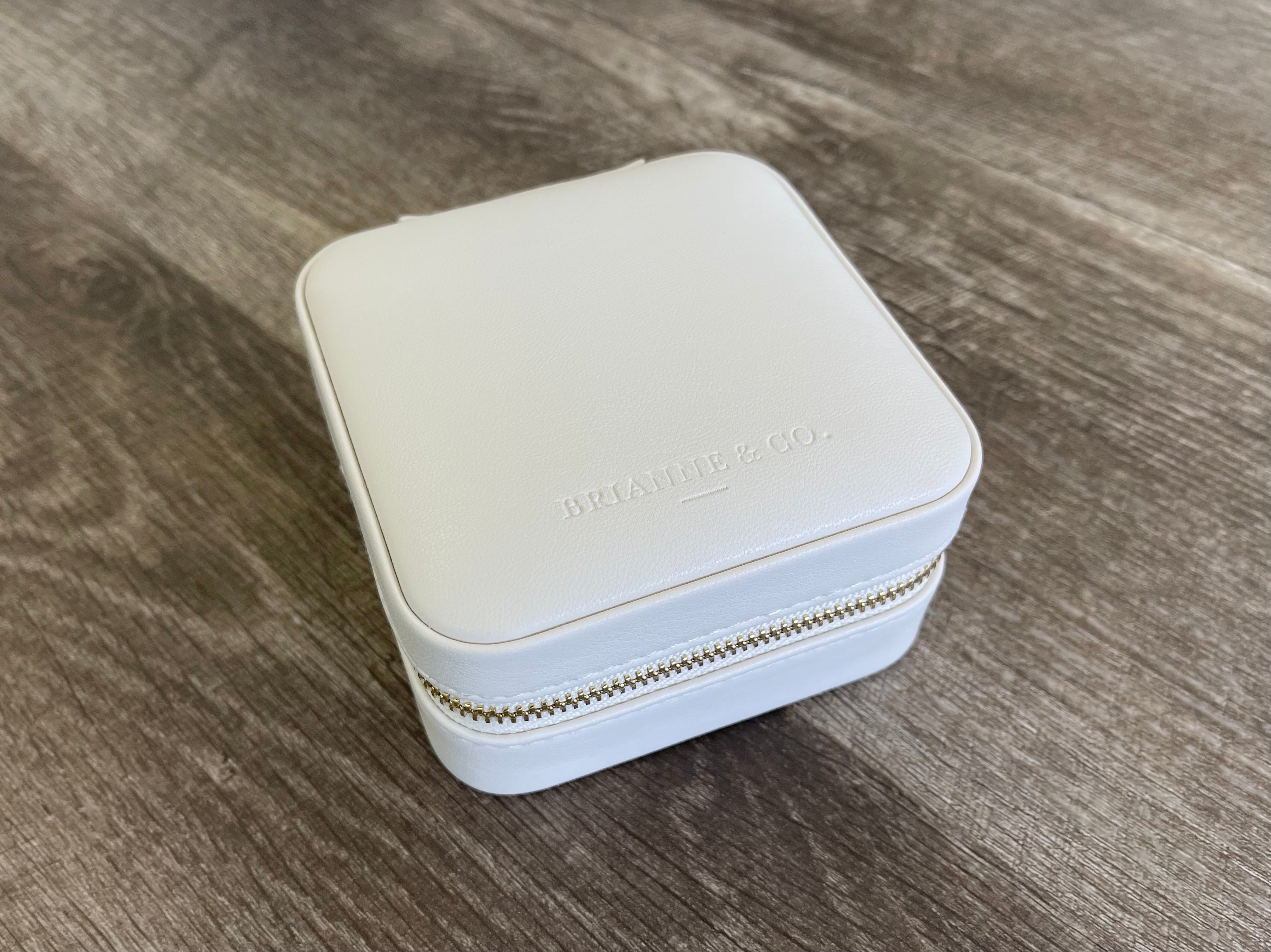 brianne and co branded white leather jewelry travel case, top view