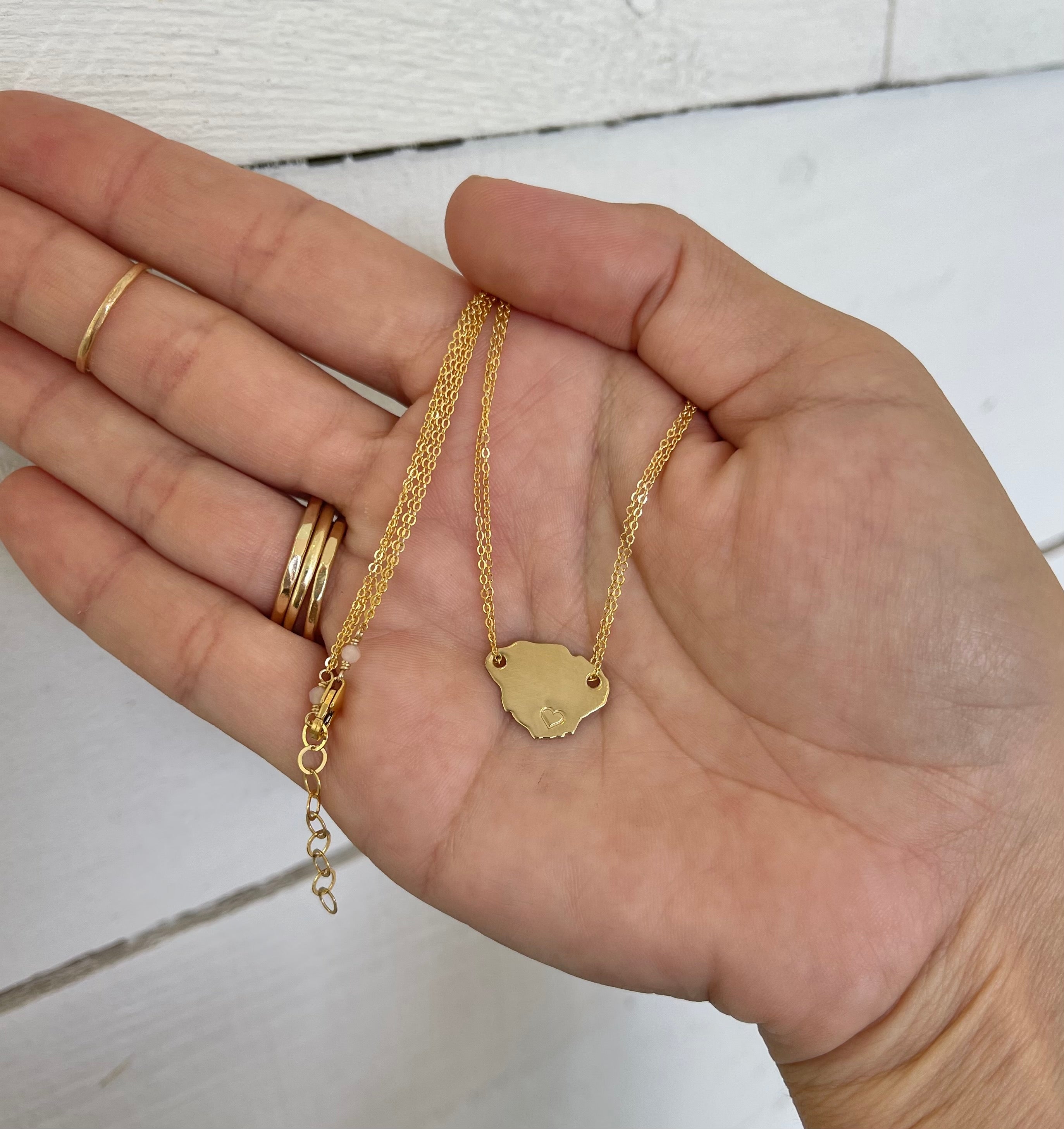 Double chain Kauai island necklace with heart stamp shown in gold filled