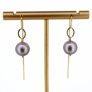 Brianne & Co gold fill pearl threader earrings shown on display stand