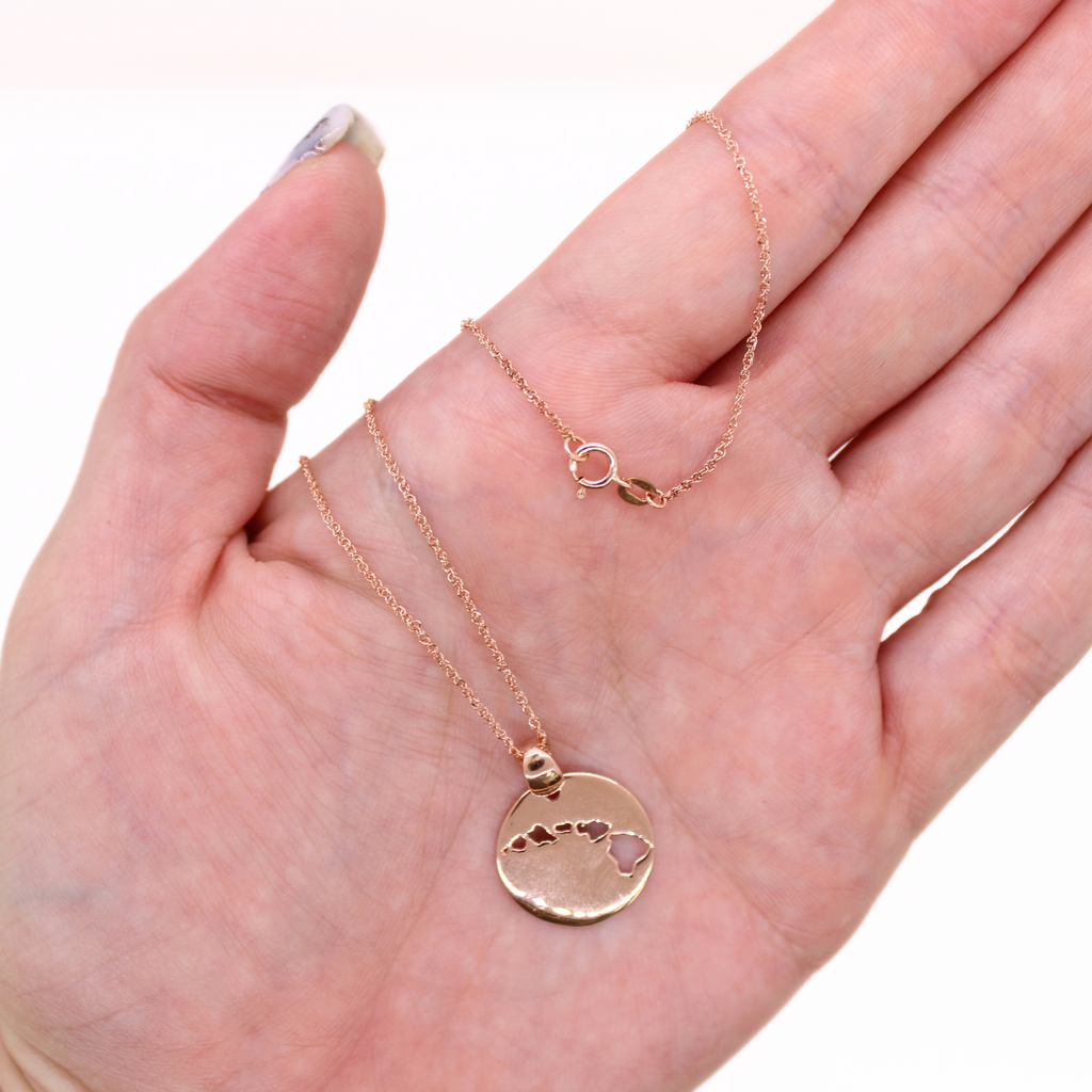 14k Rose gold Island cut out necklace, shown in hand with clasp and pendant detail