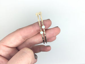 textured hammered hoop stud earrings with opal